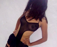 teen escort Melany wearing a see through black body stocking