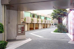 Motel de Paso driveway, showing a row of garages.