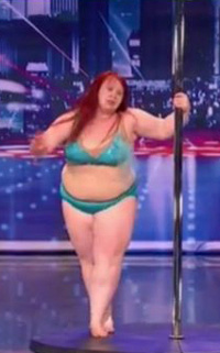 a 230 pound female stripper in a green bikini