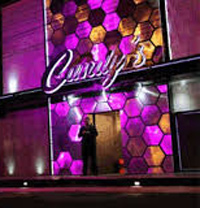 Candy's strip club outside at night with purple lights